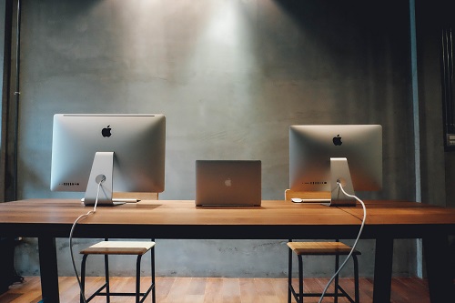 An empty desk with two workstations